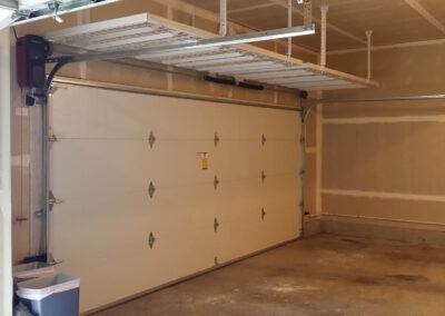 Insulated garage door with Overhead Storage